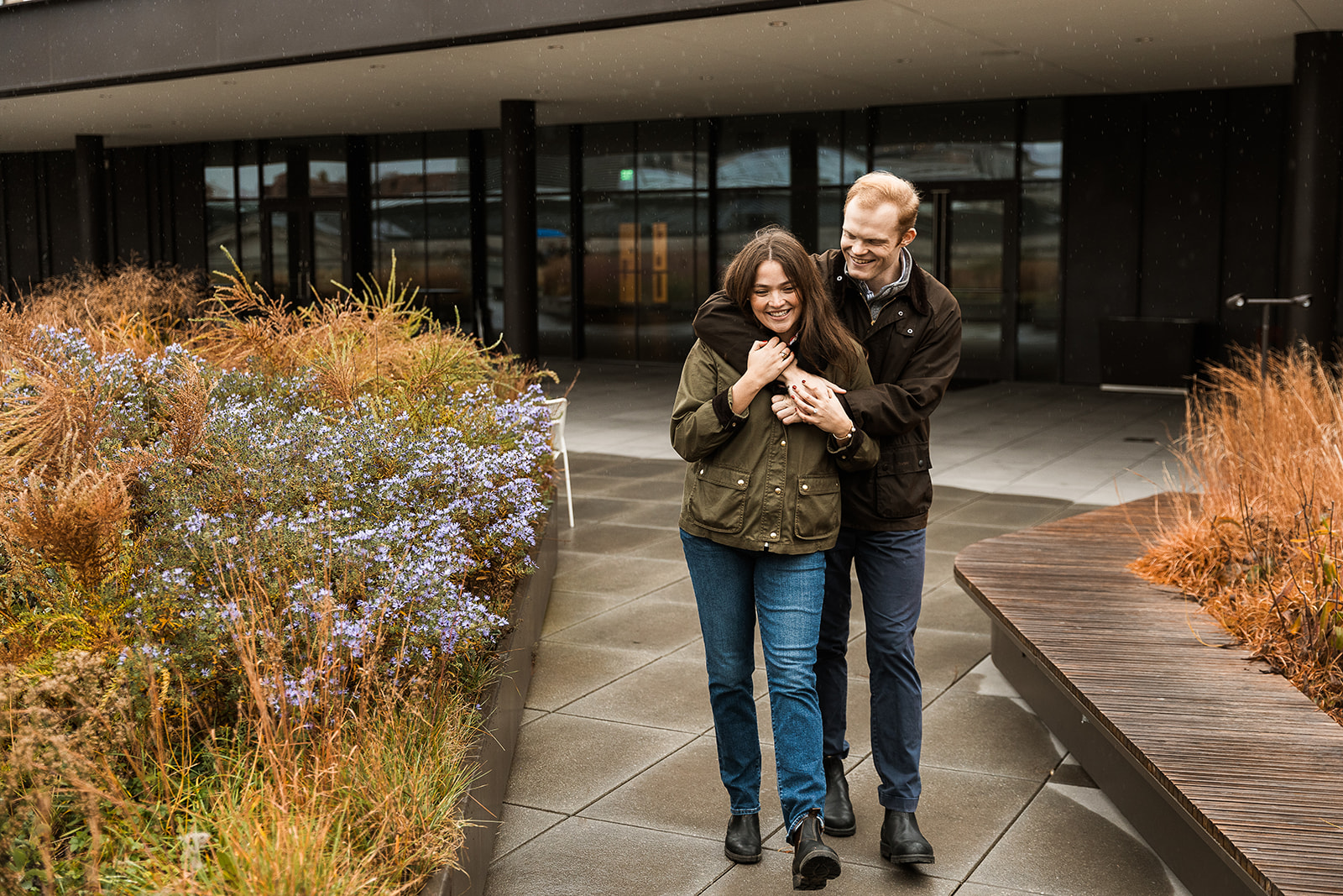 moody and rainy engagment session on a rooftop in washington dfc