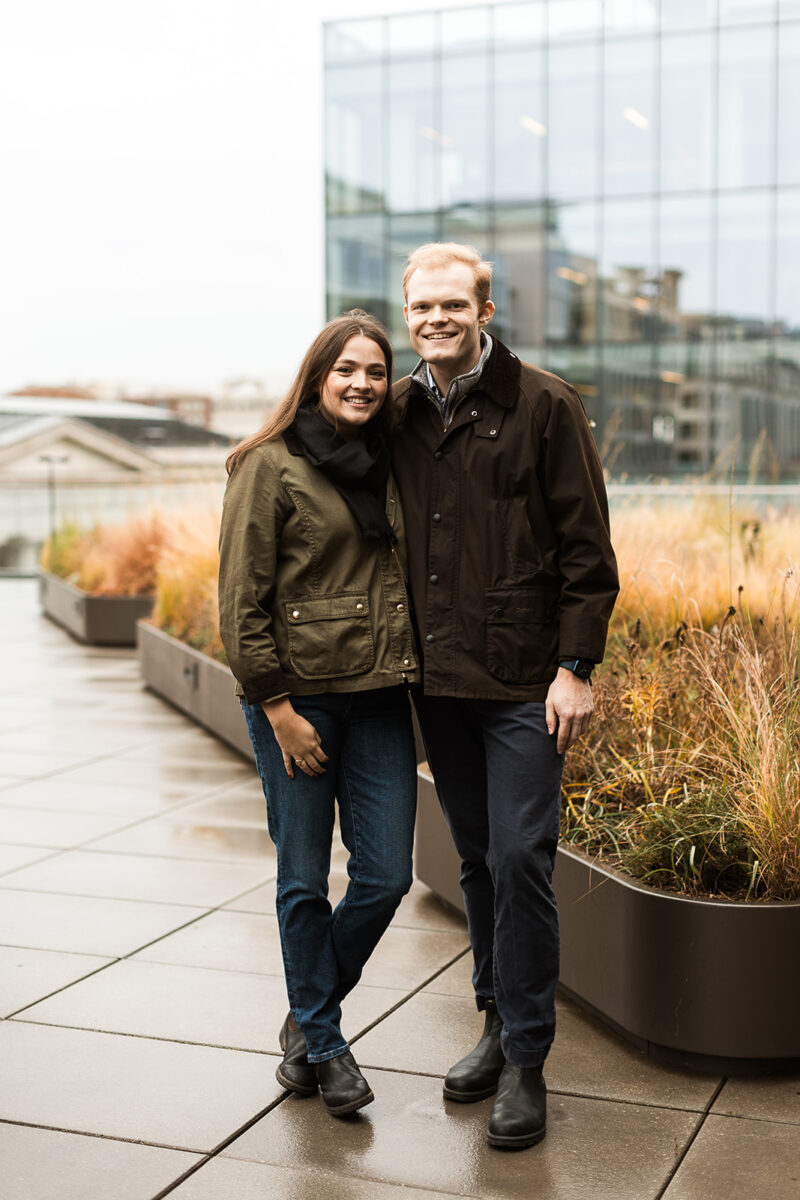 moody and rainy engagment session on a rooftop in washington dfc