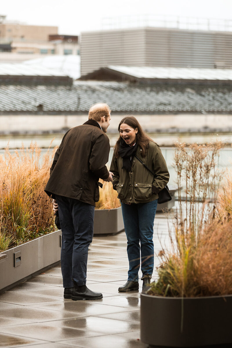 candid rooftop proposal moments at mlk library in washington dc