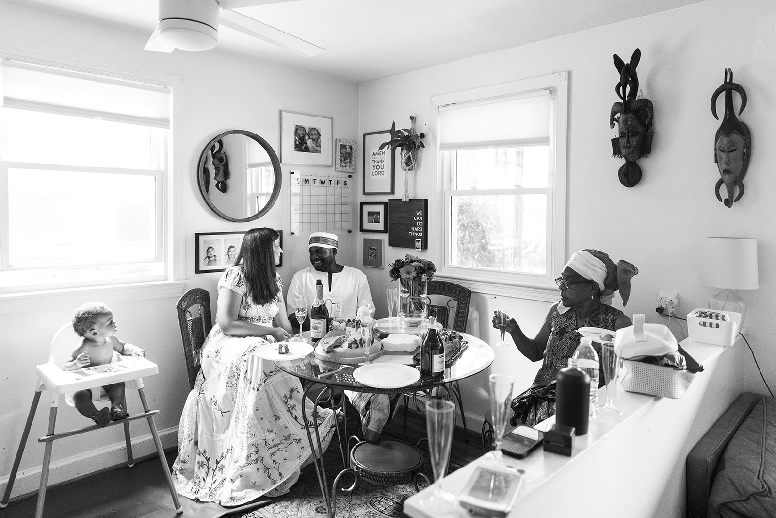bride and groom celebrating their wedding at home with family